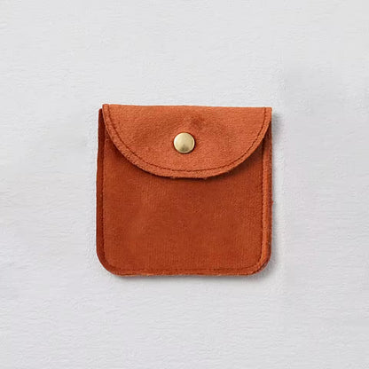 Pochette à bijoux en velours avec fermeture bouton doré