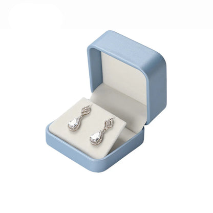 Boîte à bijoux bleue - Boîte à bijoux bleue ouverte avec boucles d'oreilles - Garde Bijoux