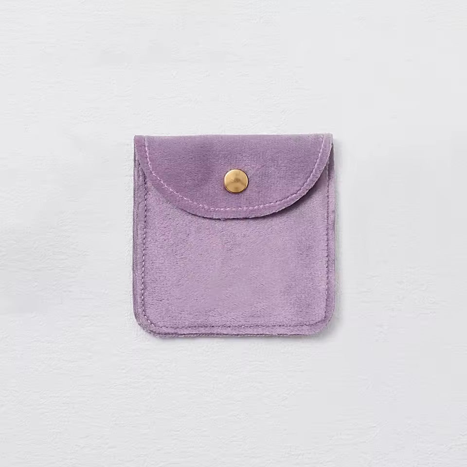 Pochette à bijoux en velours avec fermeture bouton doré