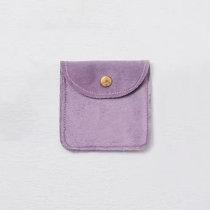 Pochette à bijoux en velours avec fermeture bouton doré