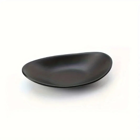 Coupelle à bijoux ovale noire - Vide poche noir design pose sur une coiffeuse - Garde Bijoux